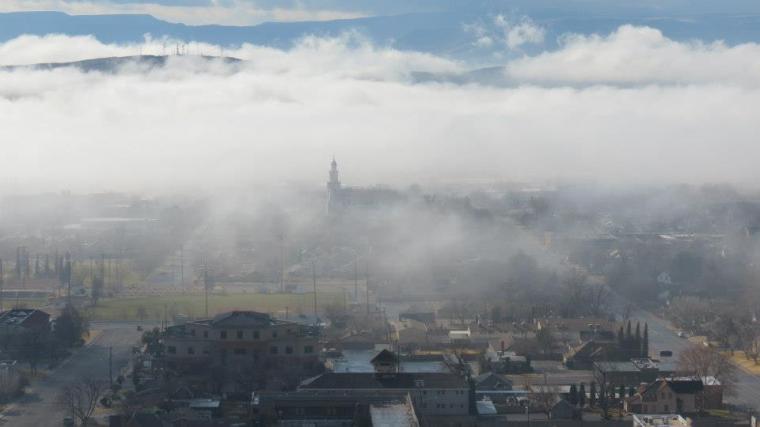This is the City of St. George. The St. George Mormon Temple is the building with the steeple in the middle of the town... But what a beautiful picture it made...